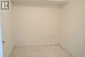 Toronto (Bendale) condo for rent - A white room with HomeLife Top Star Realty Inc. Brokerage written on the floor.