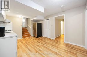 Toronto (Pleasant View) apartment for rent - A spacious room with wooden flooring and white walls.