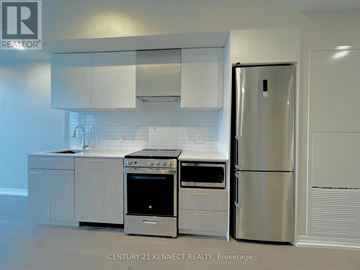 Toronto (Church-Yonge Corridor) condo for rent - A kitchen with a stainless steel refrigerator and oven.