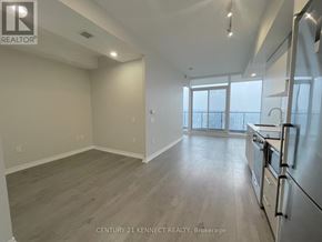 Toronto (Church-Yonge Corridor) condo for rent - A spacious kitchen with stainless steel appliances and a view of the city.