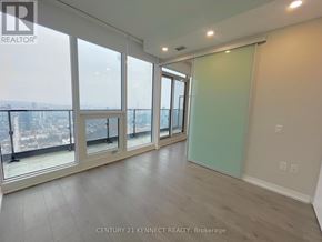 Toronto (Church-Yonge Corridor) condo for rent - A room with a view of the city through large windows.