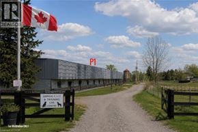 Stoney Creek apartment for rent - A sign for an animal care and training centre is on a fence in front of a building.