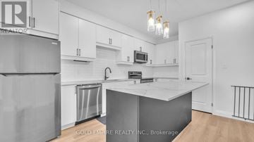 London South (South V) townhouse for rent - A kitchen with white cabinets and a white island.