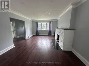 Ottawa apartment for rent - A room with a fireplace and wood flooring.