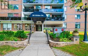 Toronto (Eglinton East) condo for rent - The entrance to a building with the sign "20 Gilder Dr." is shown.