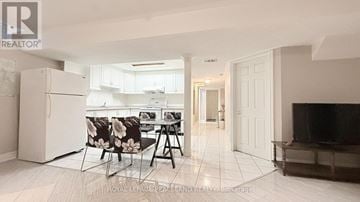 Markham (Village Green-South Unionville) apartment for rent - A living room with a television and a dining table with chairs.