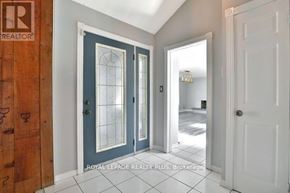 Oakville (Fd Ford) apartment for rent - A hallway with a white door and a blue door with a glass window.