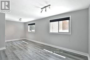 Oakville (Fd Ford) apartment for rent - A room with grey walls and a wooden floor.