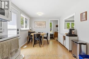 Oshawa (Donevan) apartment for rent - A dining room with a table and chairs is shown in the image.
