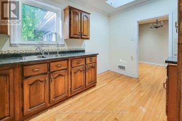 Welland (N. Welland) apartment for rent - A kitchen with wooden cabinets and a window.