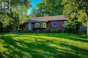 Welland (N. Welland) apartment for rent - A house with a red roof and a green lawn.