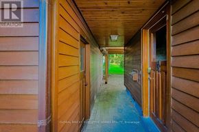 Welland (N. Welland) apartment for rent - A hallway with wooden walls and a blue floor.