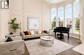 Newmarket (Stonehaven-Wyndham) apartment for rent - A living room with a piano and a couch.