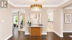Newmarket (Stonehaven-Wyndham) apartment for rent - A well-lit, spacious hallway with a chandelier and a reception desk.