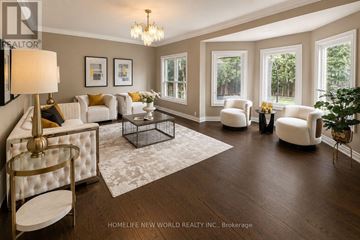 Newmarket (Stonehaven-Wyndham) apartment for rent - A well-lit, spacious living room with a white sofa set and a chandelier.