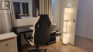 Toronto (Church-Yonge Corridor) condo for rent - A kitchen with wooden floors and a table with a bowl on it.