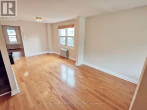 Toronto (Woodbine-Lumsden) apartment for rent - A room with wooden flooring and a window.
