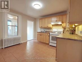 Toronto (Woodbine-Lumsden) apartment for rent - A kitchen with a stove top oven and a counter top.