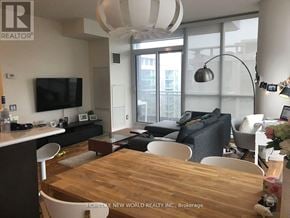 Toronto (Willowdale East) condo for rent - A modern living room with a wooden table and chairs.