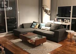 Toronto (Willowdale East) condo for rent - A living room with a grey couch and a coffee table.
