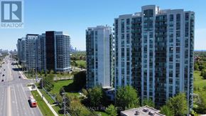 Mississauga (Central Erin Mills) condo for rent - A real estate company logo is displayed on a building in a city.