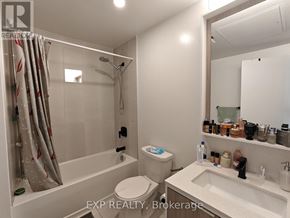 Toronto (Islington-City Centre West) condo for rent - A bathroom with a toilet, sink, and shower.