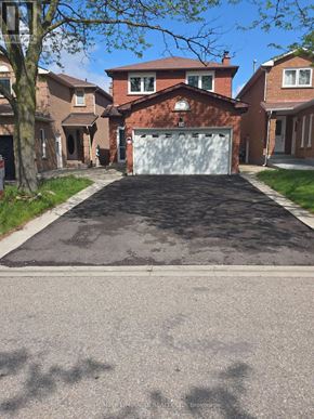 Brampton (Fletcher's Creek South) apartment for rent - A bathroom with a toilet, sink, and a door.