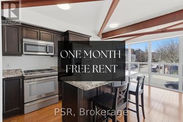 Toronto (Mount Pleasant East) apartment for rent - A kitchen with a stove top oven and a refrigerator with a water dispenser.