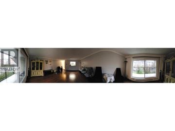 Coquitlam apartment for rent - A living room with a couch and a cat on it.