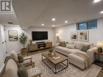 Toronto (Forest Hill South) fourplex for rent - A well-lit living room with a sofa, chairs, and a coffee table.