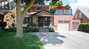 Brampton (Downtown Brampton) apartment for rent - A house with a red umbrella and a tree in front.