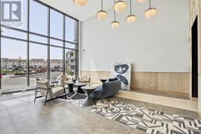 Burlington (Alton) condo for rent - A waiting area with a large window and a view of the outside.