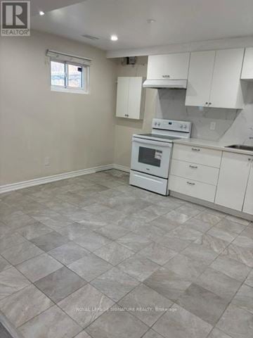 Mississauga (Erindale) apartment for rent - A kitchen with white cabinets and a tiled floor.