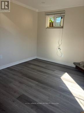Mississauga (Erindale) apartment for rent - A room with a window and wooden flooring.