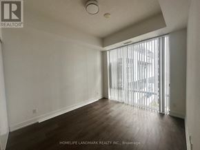 Toronto (Bayview Village) condo for rent - A room with a sliding glass door leading to a balcony.