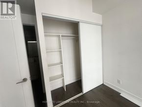 Toronto (Bayview Village) condo for rent - A white closet with shelves and a door.