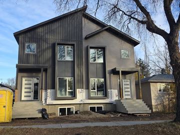 Edmonton apartment for rent - A house under construction with a sign that says "TK".