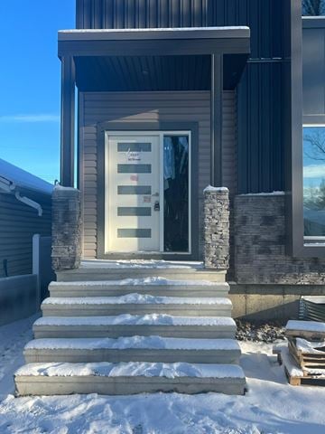 Edmonton apartment for rent - A house with a white door and steps leading up to it.