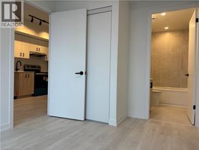 Burlington condo for rent - A white door is open to a bathroom.