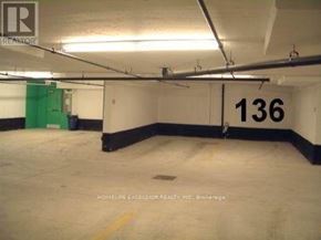 Toronto (Woburn) condo for rent - A parking garage with the number 136 on the wall.