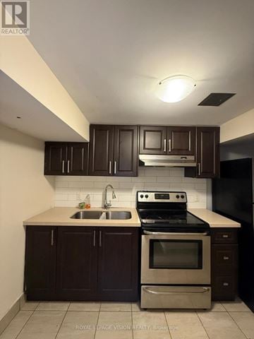 Toronto (Woburn) apartment for rent - A kitchen with dark brown cabinets and stainless steel appliances.