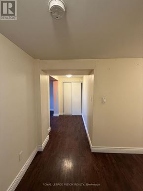 Toronto (Woburn) apartment for rent - A hallway with wood floors and white walls.