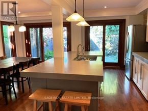 Toronto (Broadview North) apartment for rent - A kitchen with a large island and pendant lights.