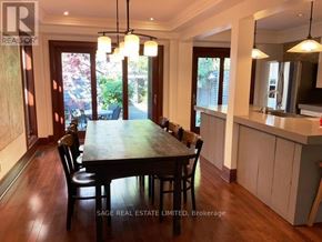Toronto (Broadview North) apartment for rent - A dining room with a table and chairs and a mirror on the wall.