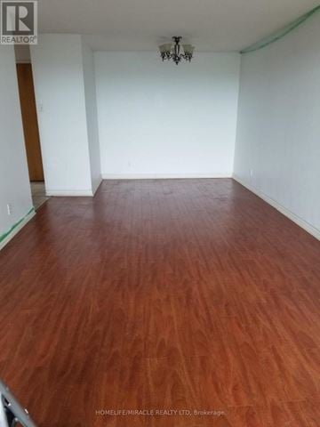 Toronto (Mount Olive-Silverstone-Jamestown) condo for rent - A room with wooden flooring and white walls.