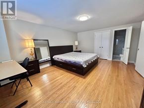 Toronto (L'amoreaux) apartment for rent - A bedroom with a bed, desk, and chair.
