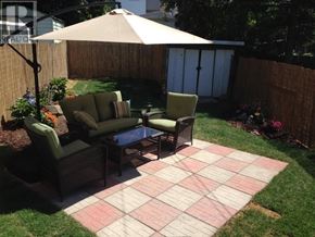 Toronto (Oakwood Village) apartment for rent - A patio with a table and chairs under an umbrella.