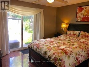 Toronto (Oakwood Village) apartment for rent - A bedroom with a floral bedspread and a ceiling fan.