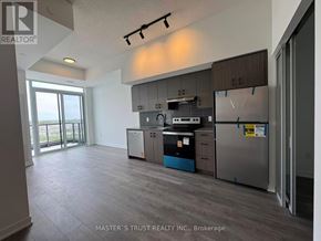 Burlington (Alton) condo for rent - A kitchen with a refrigerator, stove, and oven.