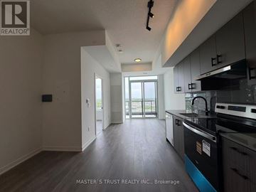 Burlington (Alton) condo for rent - A kitchen with a stove top oven and a dishwasher.